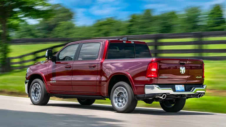 Our 2025 Ram 1500 Laramie 4x4 long-termer in motion on a country road.